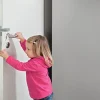 Bloque porte en mousse avec cordelette à accrocher