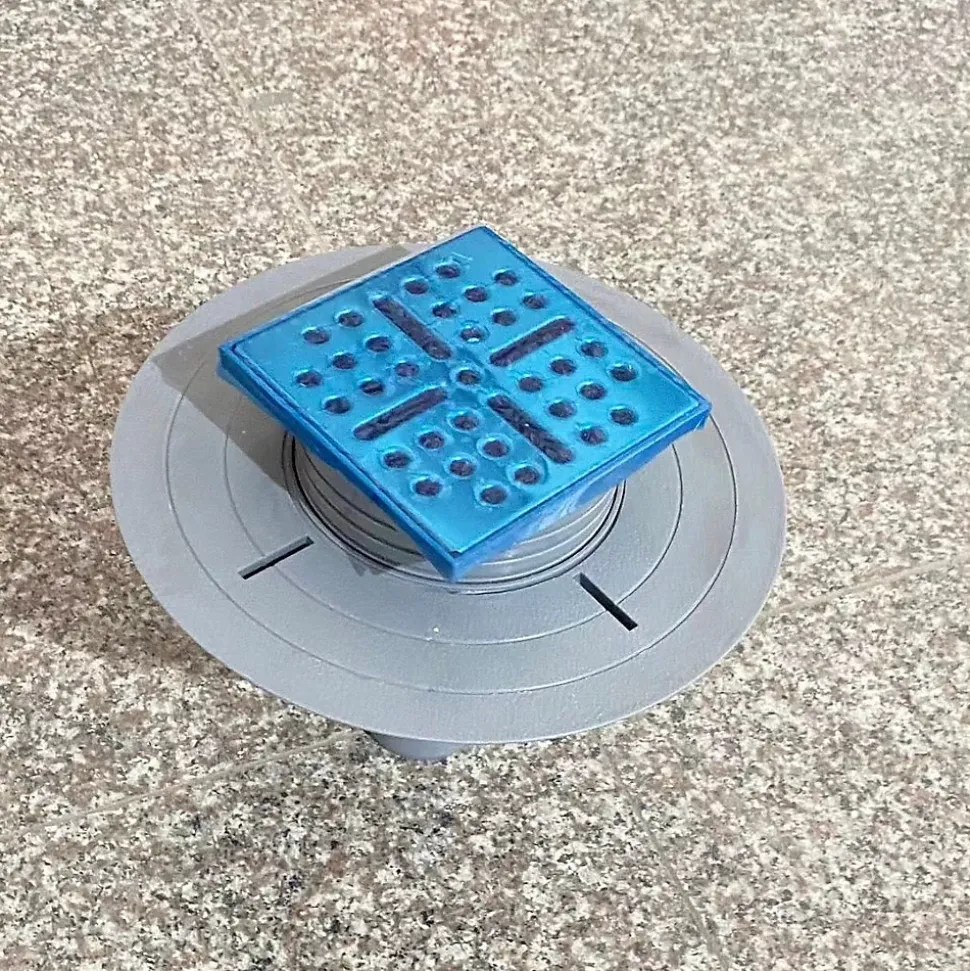 Bonde verticale DINO pour receveurs à carreler avec grille en acier inoxydable