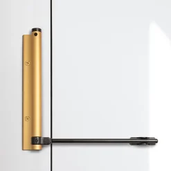 Bras à ressort ferme porte, a corps très fin en Aluminium anodisé or