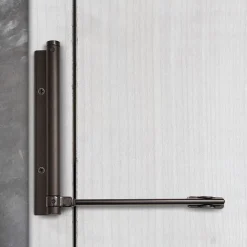 Bras à ressort ferme porte, a corps très fin en Aluminium anodisé noir