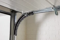 Motorisation pour porte de garage sectionnelle